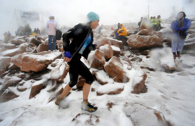 Brandy Erholtz of Bailey was the first female finisher of the Pikes Peak ascent on Saturday. Simon Gutierrez of Alamosa captured his third ascent title for the men.