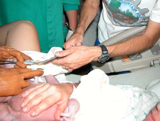 Matt cutting the cord between Yvonne and Kyla