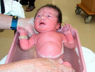 Kyla gets her first bath